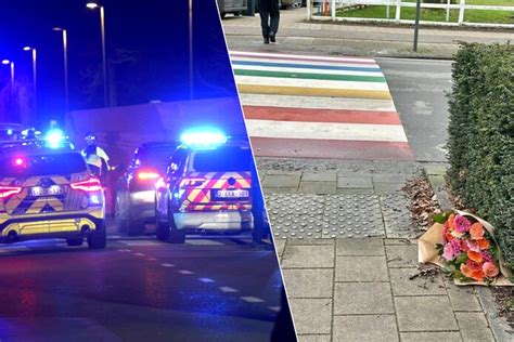 Bloemen en kaars op de plaats van het ongeval